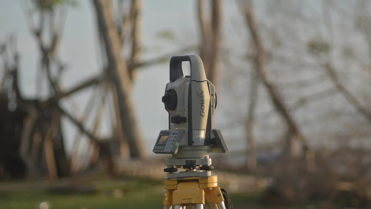 surveying instrument on tripod for yard grading